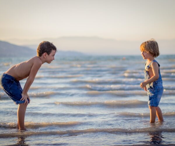 Two children playing in the water